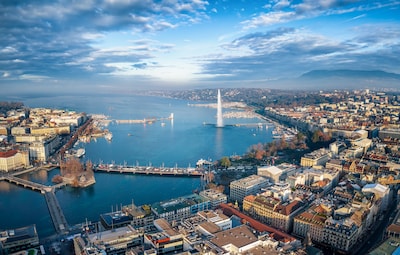 Genève: dé onderhandelingsplek waar diners zijn aangepast en vele demonstranten en spionnen rondlopen